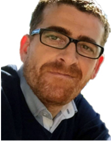 Ein Mann mit Brille und Bart.