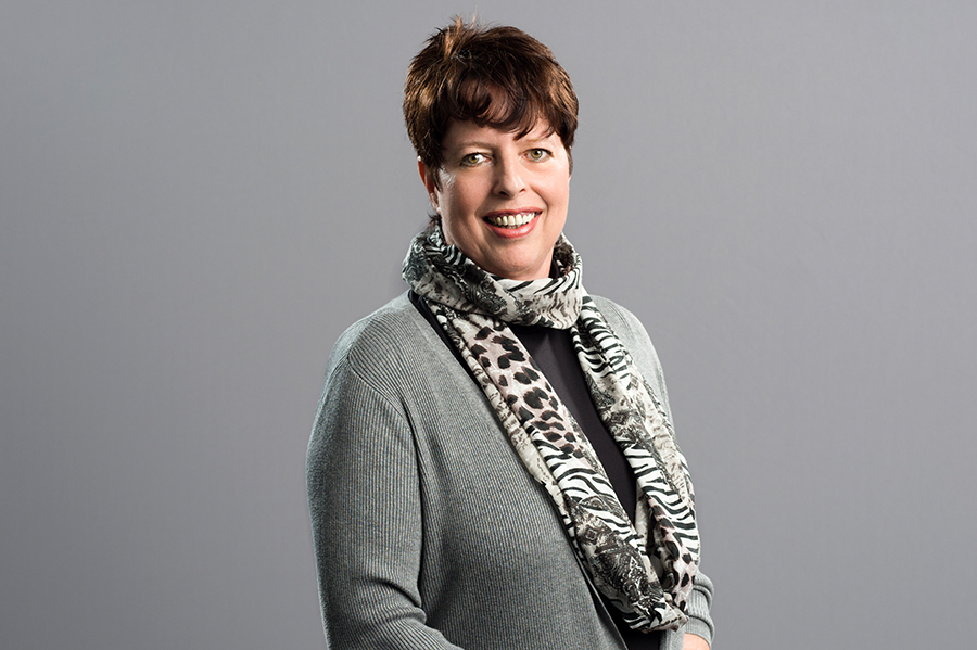 Tatiana Rezan-Sirotinskis, Talent Attraction at Kapsch TrafficCom, smiling with a scarf around her neck.